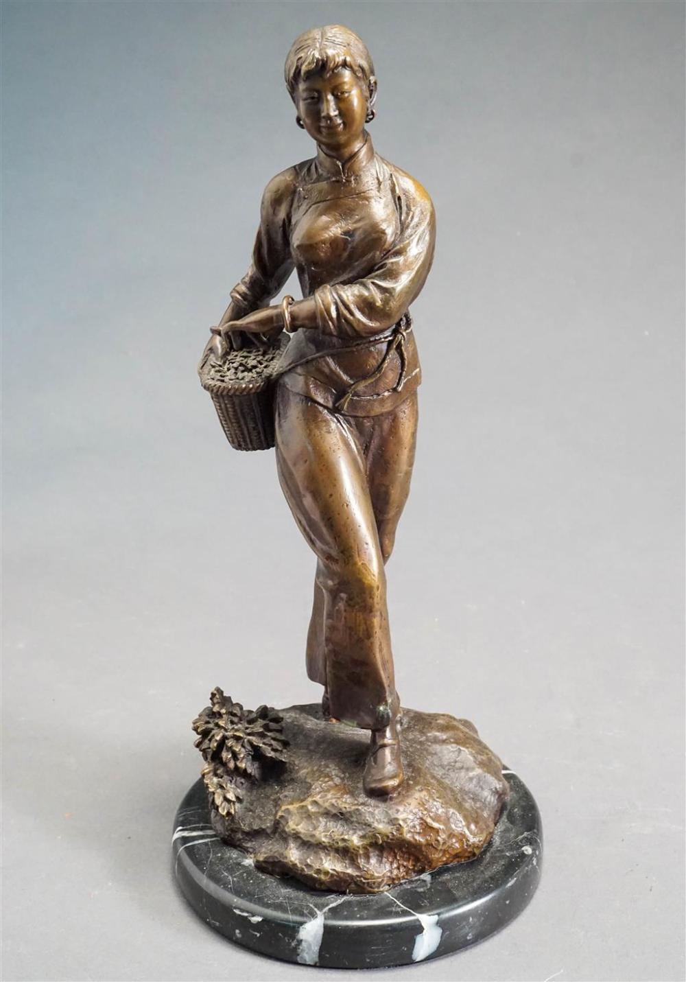 BRONZE FIGURE OF A WOMAN WITH BASKET