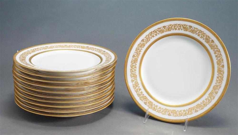 ELEVEN LIMOGES GILT BORDER SERVICE PLATES,