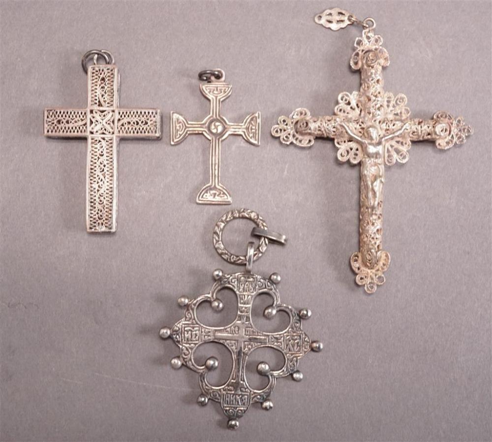 FOUR SILVER CRUCIFORM PENDANTSFour Silver