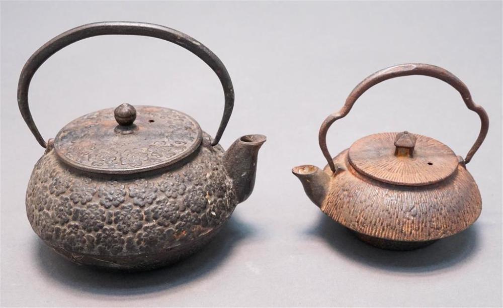 TWO JAPANESE CAST-IRON FLORAL DECORATED