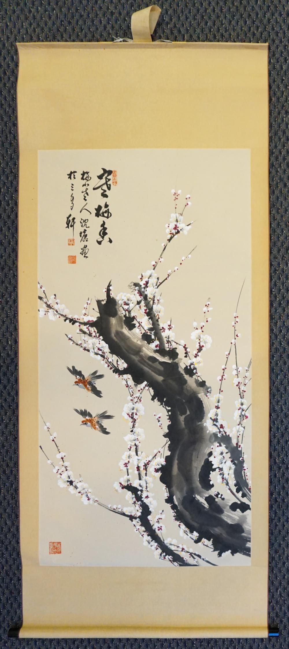 TWO BIRDS FLYING BENEATH A FLOWERING