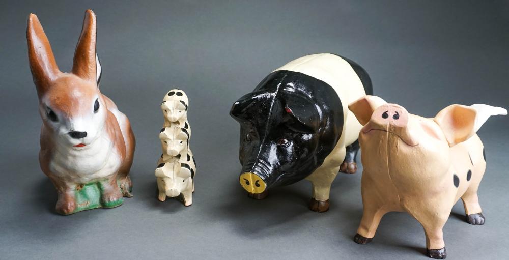 THREE DECORATED CAST IRON PIG FIGURES