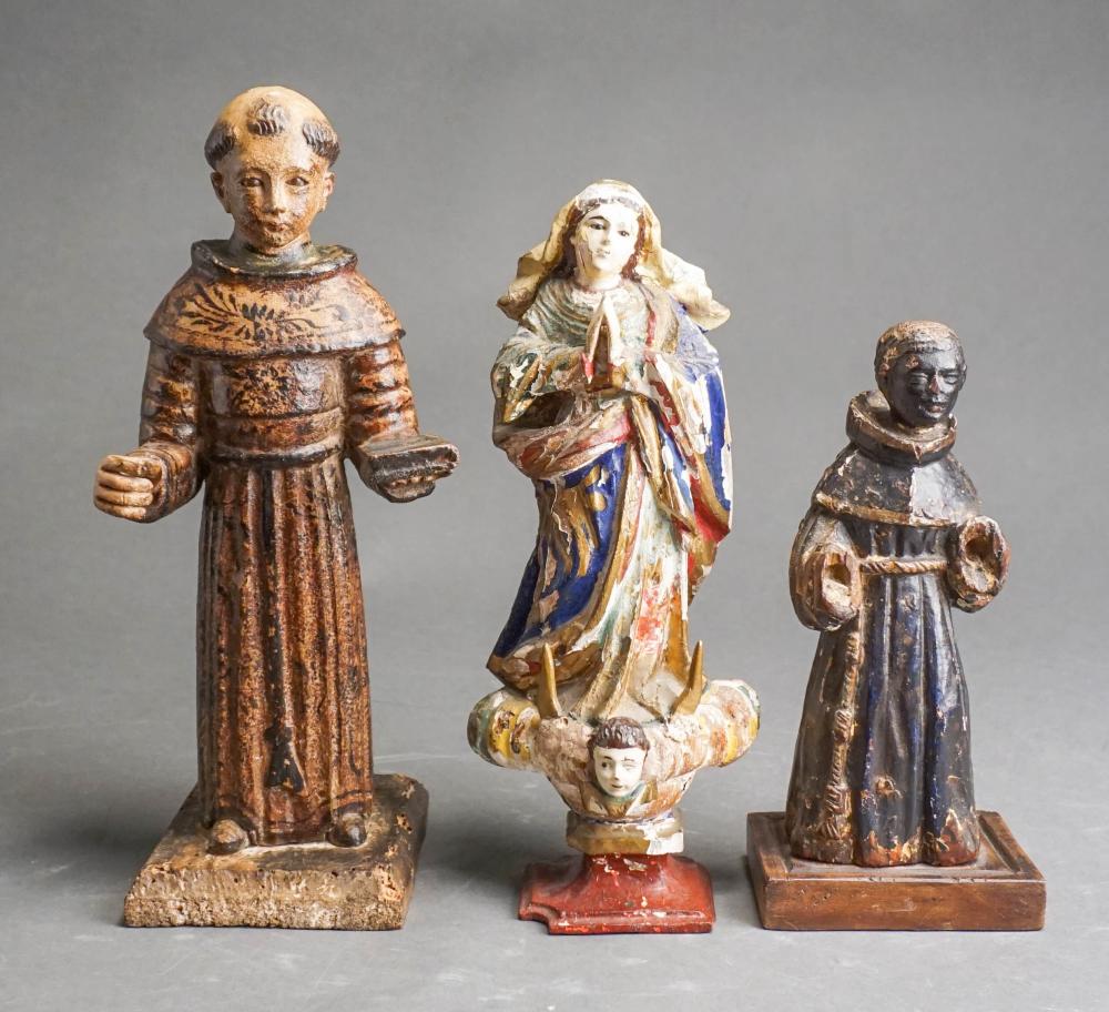 THREE SANTOS CARVED AND PAINTED