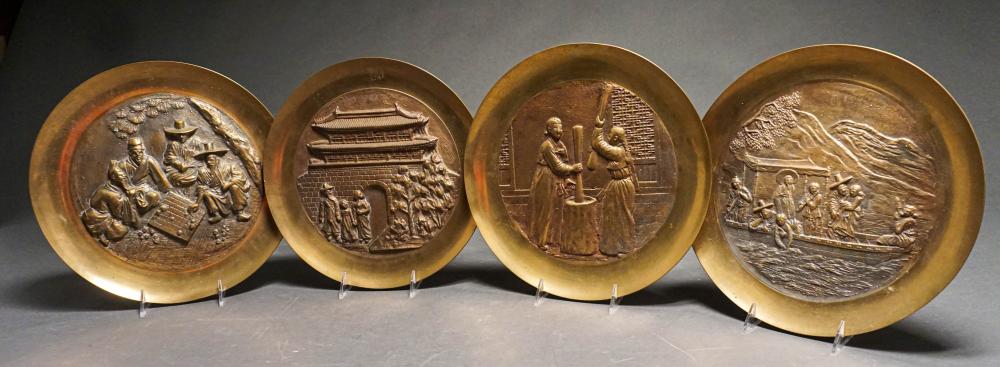 FOUR CHINESE ROUND BRASS PLAQUES