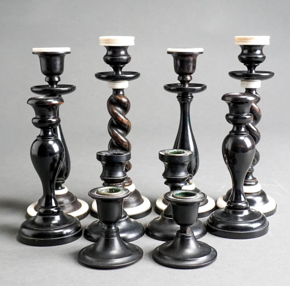 FIVE ASSORTED PAIRS OF EBONY CANDLESTICKS