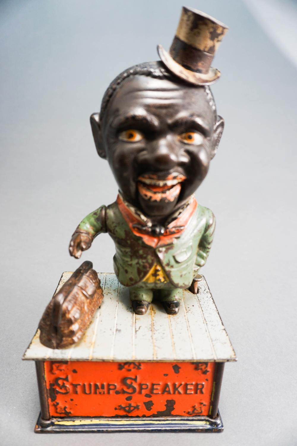 ‘STUMP SPEAKER’ PAINTED CAST IRON