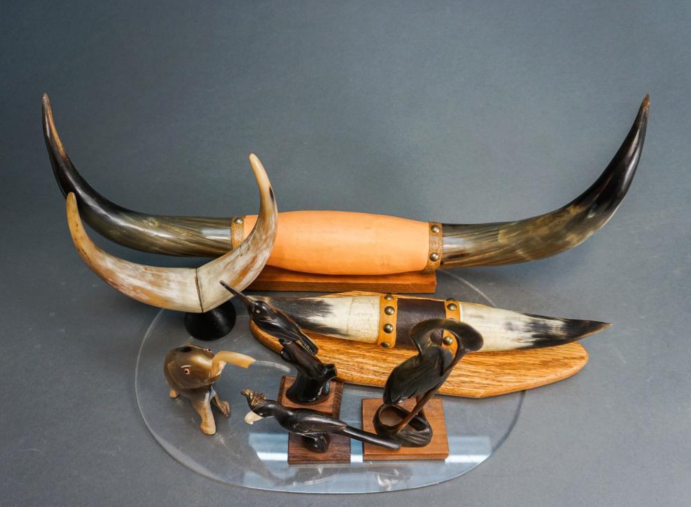 GROUP OF FOUR CARVED HORN ANIMAL