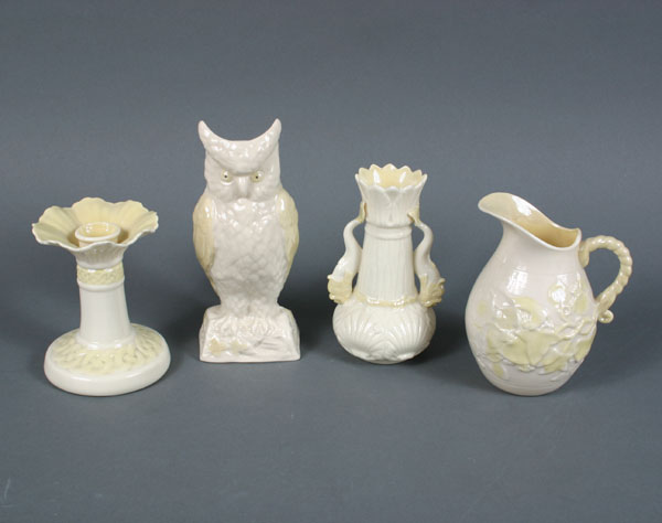 Four Belleek pieces; owl vase, candlestick,