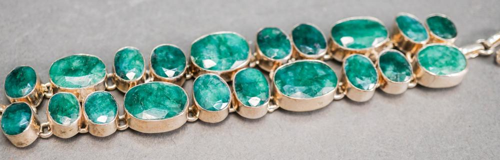 MODERNIST STYLE OVAL CUT EMERALD