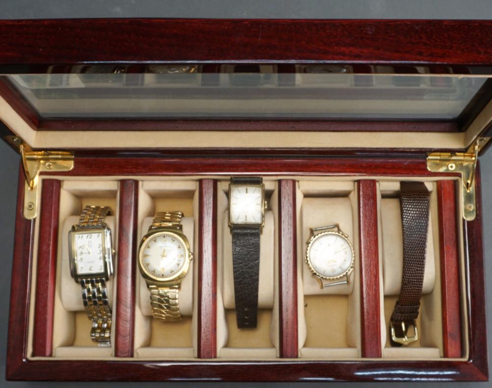 FOUR FASHION WATCHES AND A FIVE-WATCH