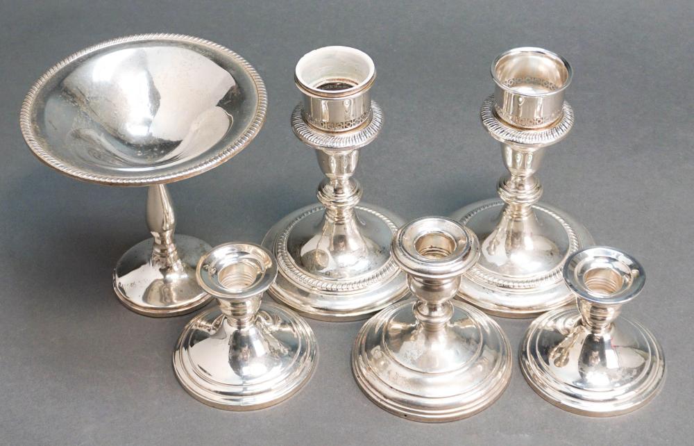 FIVE STERLING CANDLESTICKS AND 32b2ce