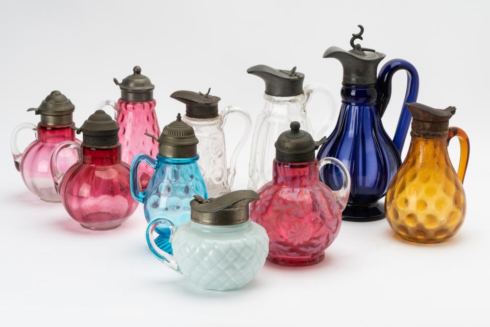 GROUP OF TEN COLORED & CLEAR GLASS SYRUP