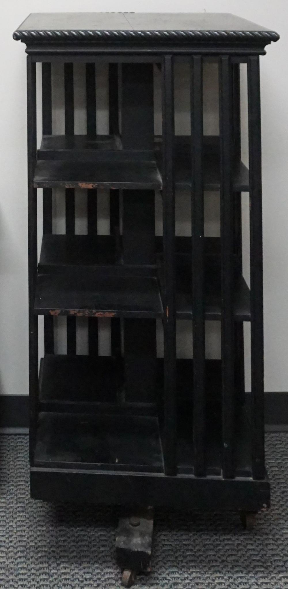 EBONIZED WOOD REVOLVING BOOKCASE,