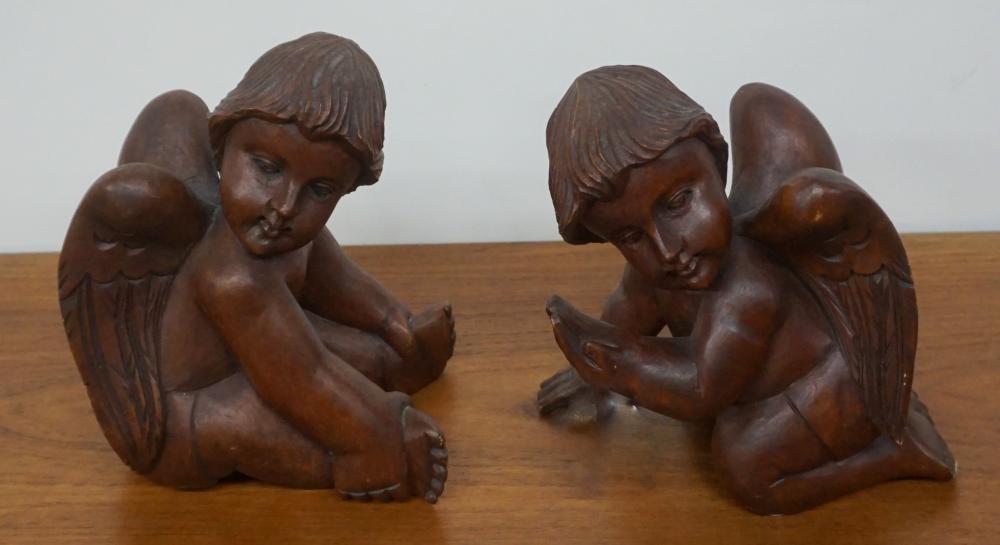 TWO CARVED WOOD PUTTO FIGURES  32e22f