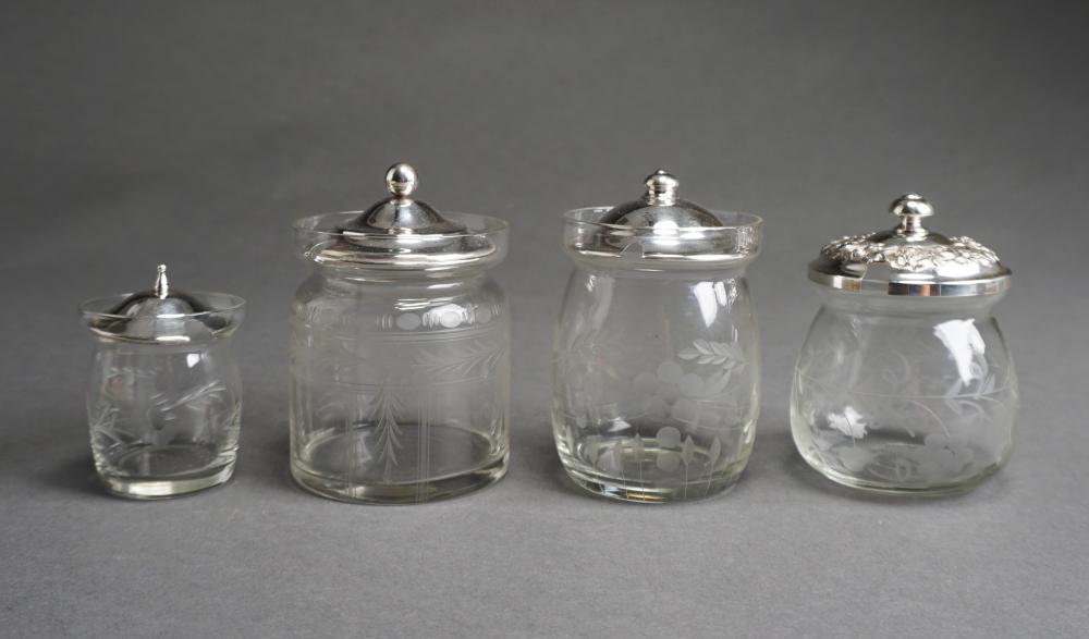 FOUR STERLING SILVER LIDDED GLASS