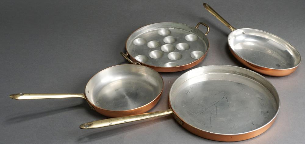FOUR COPPER AND BRASS HANDLE PANS,