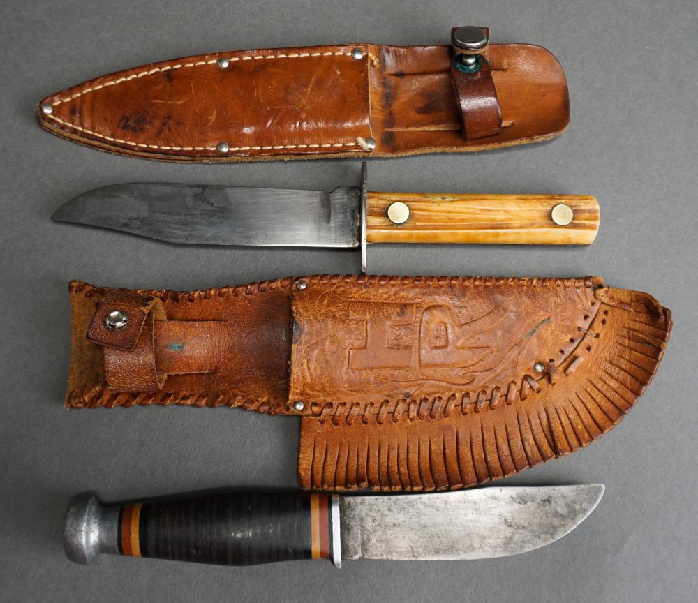 TWO HUNTING KNIVES IN LEATHER SHEATHSTwo 32f414