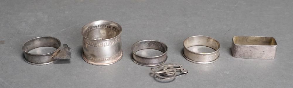 FIVE STERLING SILVER NAPKIN RINGS AND