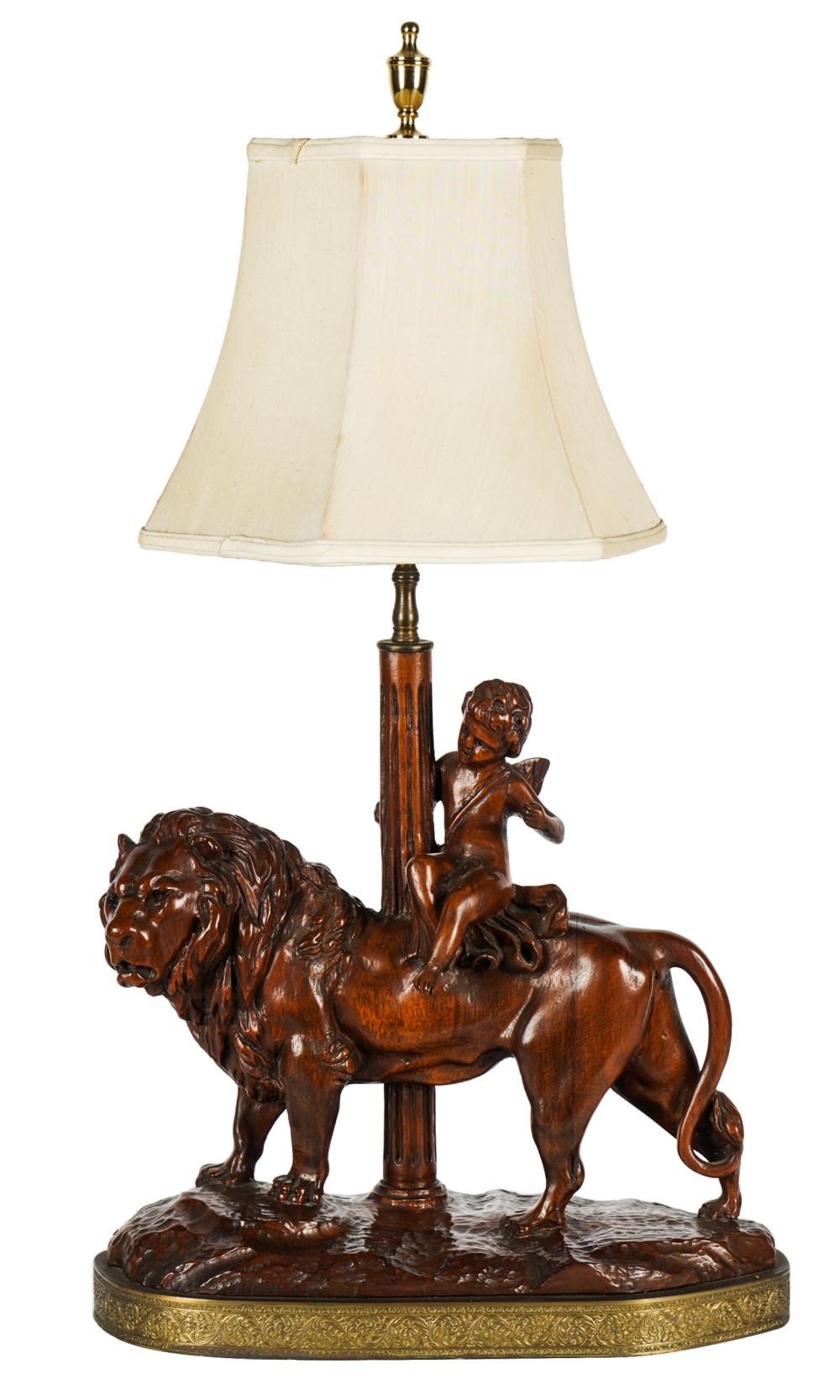 CARVED WOOD TABLE LAMPdepicting a cherub