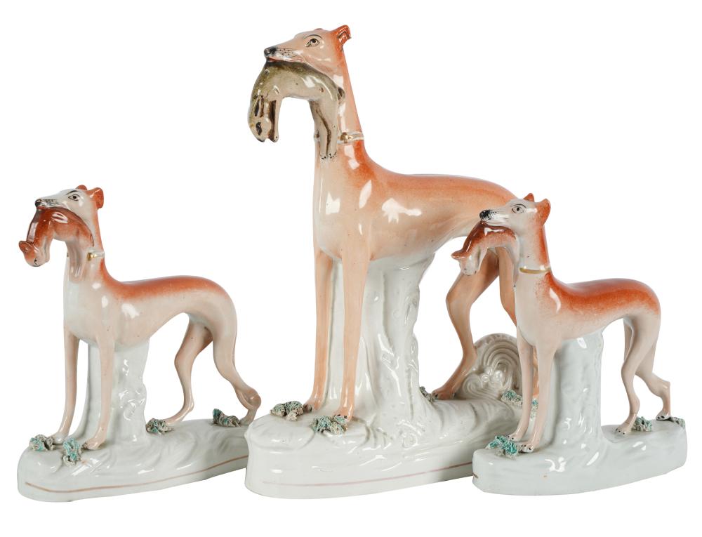 THREE STAFFORDSHIRE POTTERY DOG