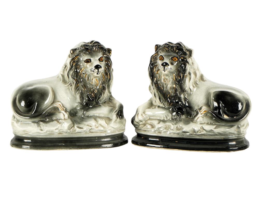 PAIR OF STAFFORDSHIRE POTTERY LION