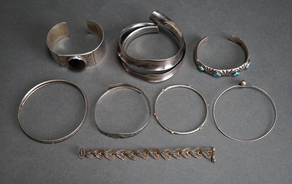 EIGHT MOSTLY SILVER BRACELETSEight Mostly