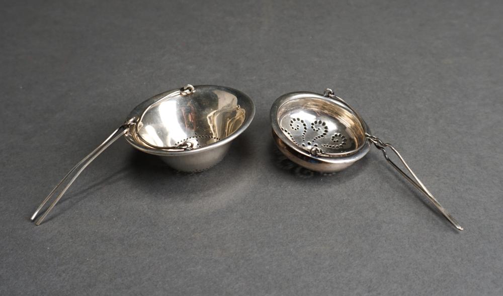 TWO STERLING SILVER TEA STRAINERS,