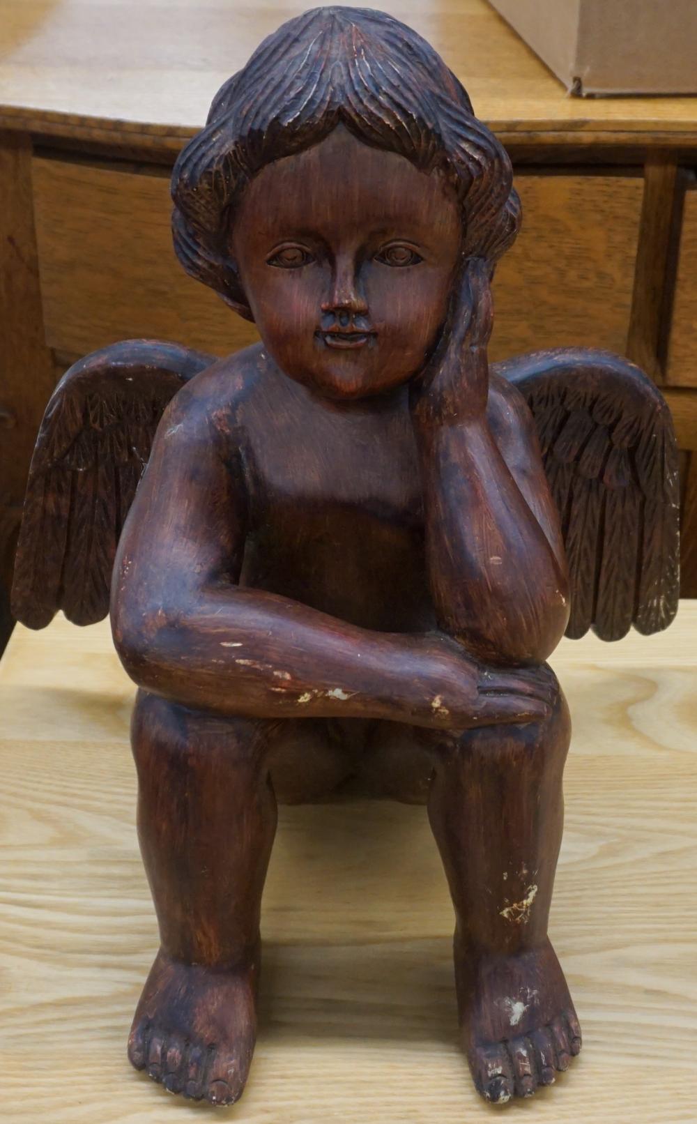 CARVED WOOD FIGURE OF A PUTTO,