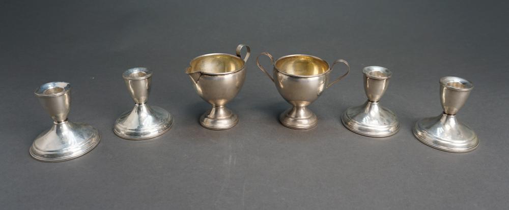 FOUR WEIGHTED STERLING SILVER CANDLEHOLDERS