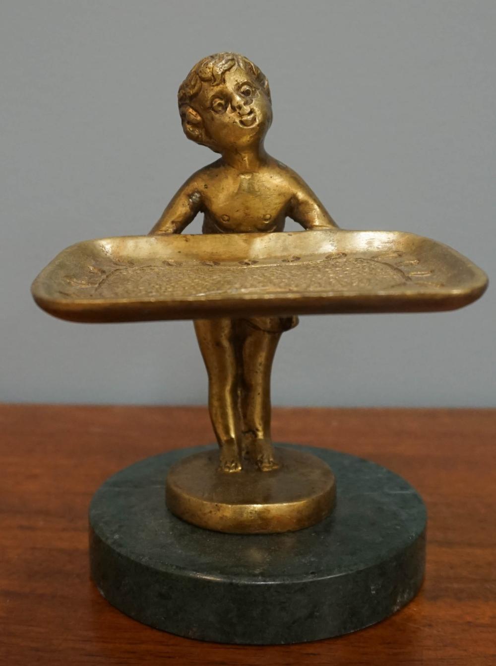 BRONZE FIGURE OF CHILD WITH SERVING