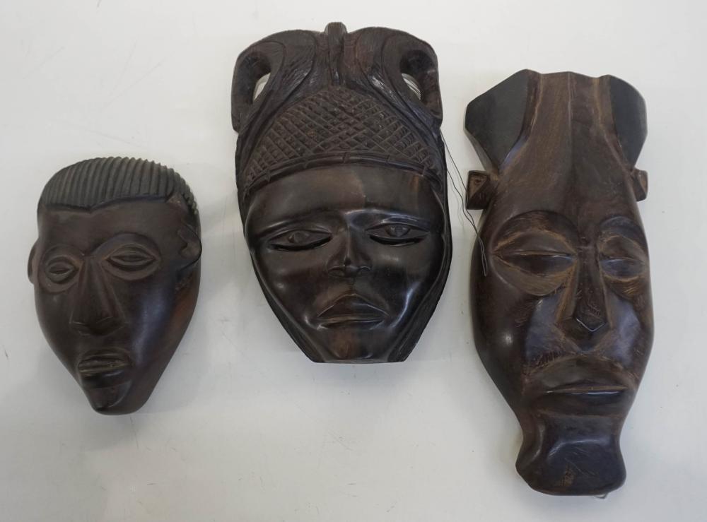 THREE AFRICAN CARVED WOOD MASKSThree 331275