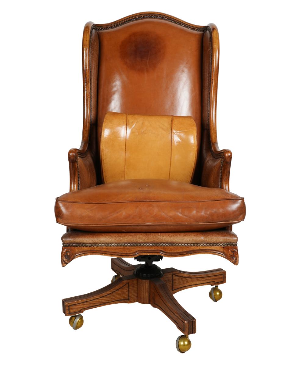 LEATHER DESK CHAIRon casters; Provenance: