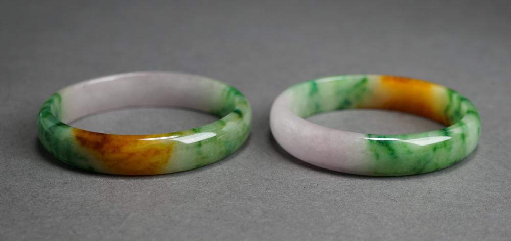 PAIR OF MOTTLED JADE BANGLE BRACELETS