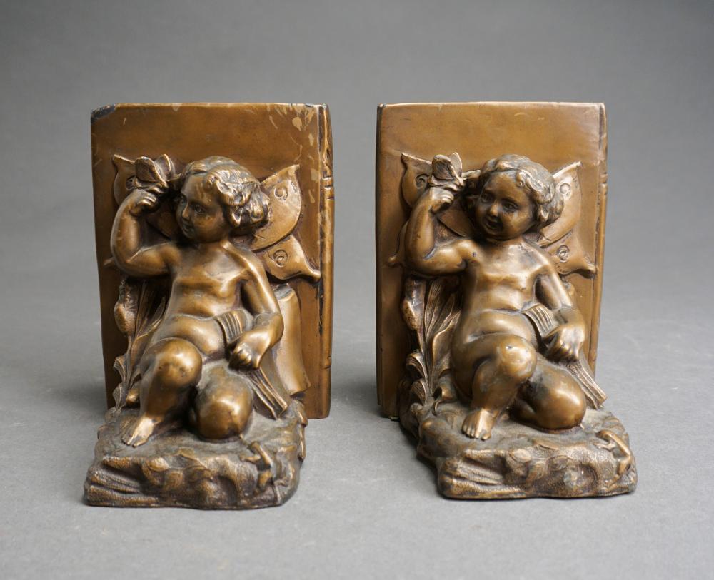 PAIR PATINATED METAL PUTTI-FORM