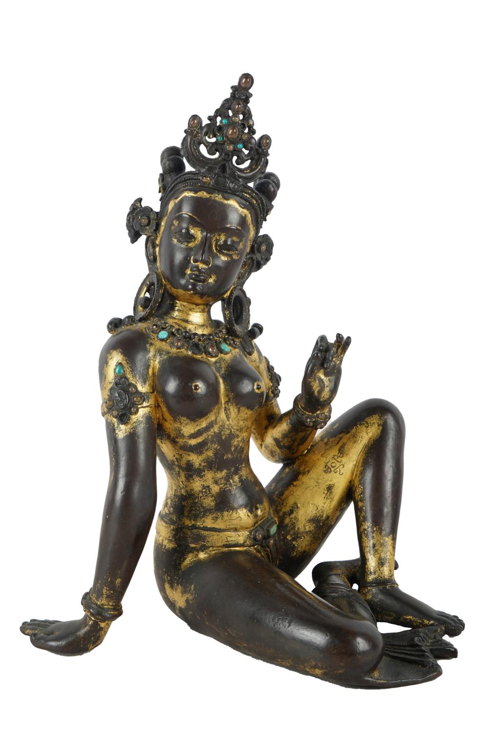 SOUTH-EAST ASIAN GILT BRONZE DEITYdepicted