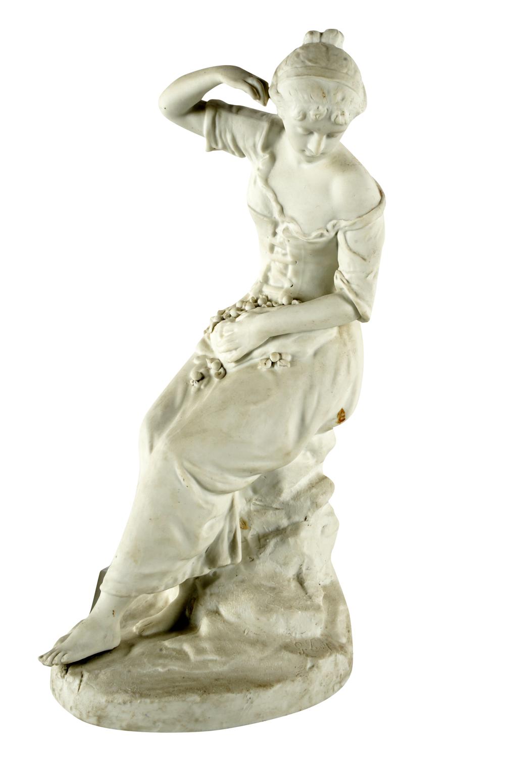 BISQUE PORCELAIN FIGURE OF A SEATED