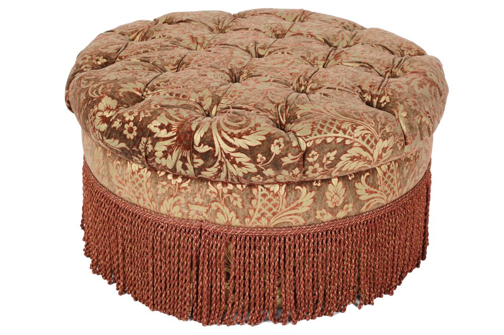 A RUDIN UPHOLSTERED ROUND OTTOMANmanufacturer s 33390b