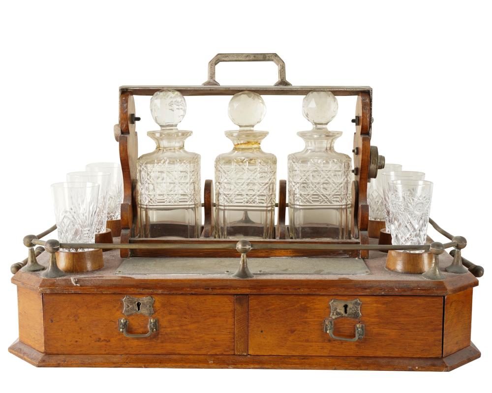 TANTALUS SETwith three cut-glass decanters