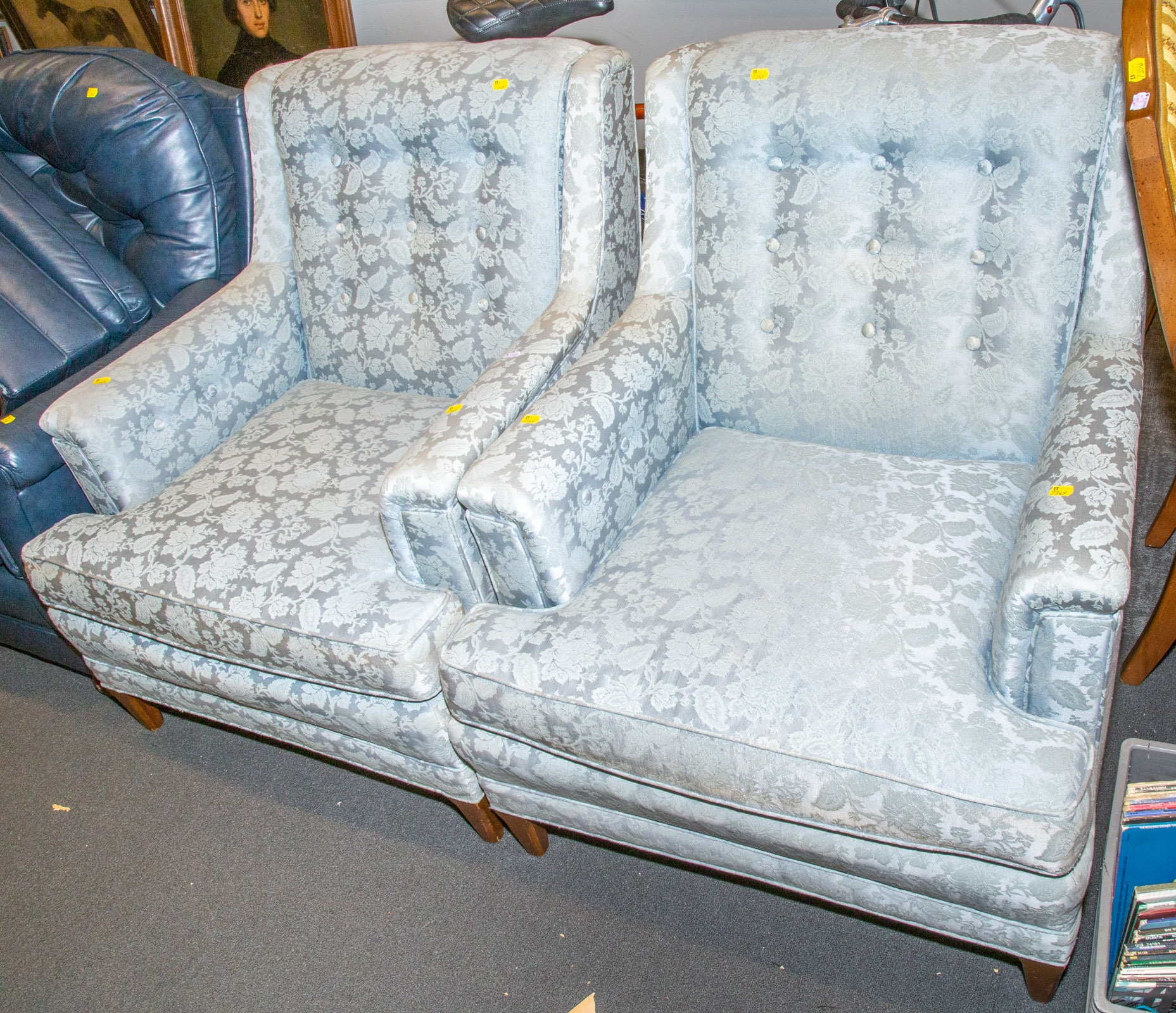 A PAIR OF UPHOLSTERED LOUNGE CHAIRS