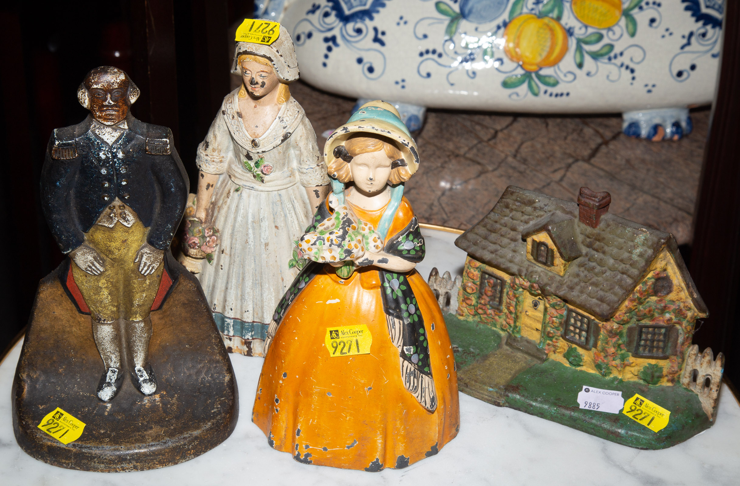 FOUR FIGURAL CAST IRON BOOKENDS