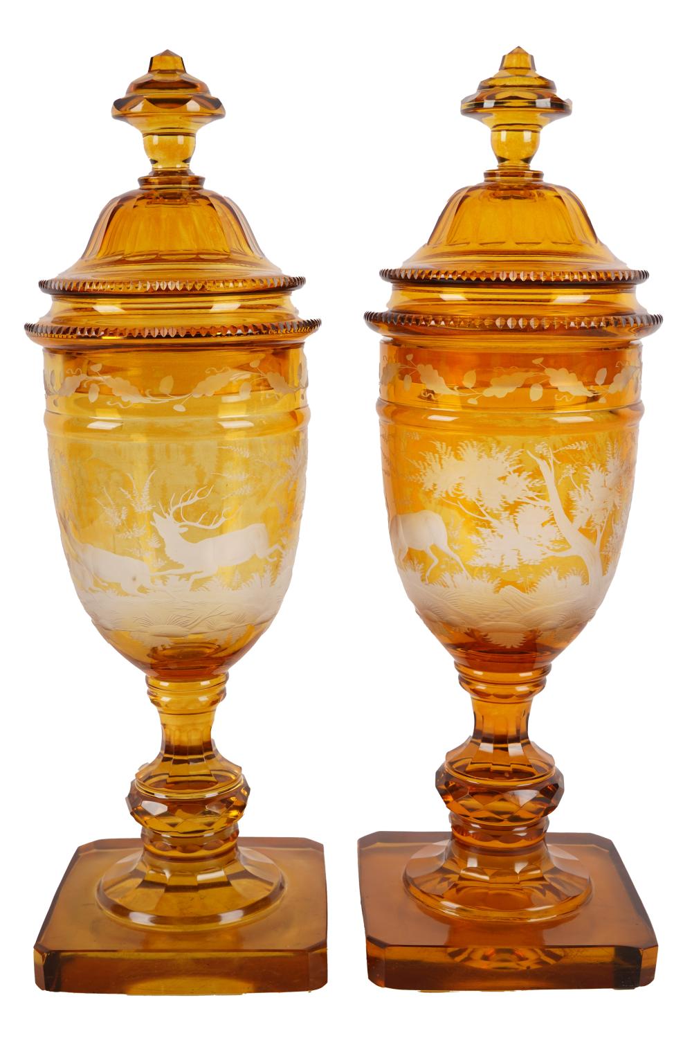 PAIR OF ETCHED AMBER GLASS JARSdepicting 332963