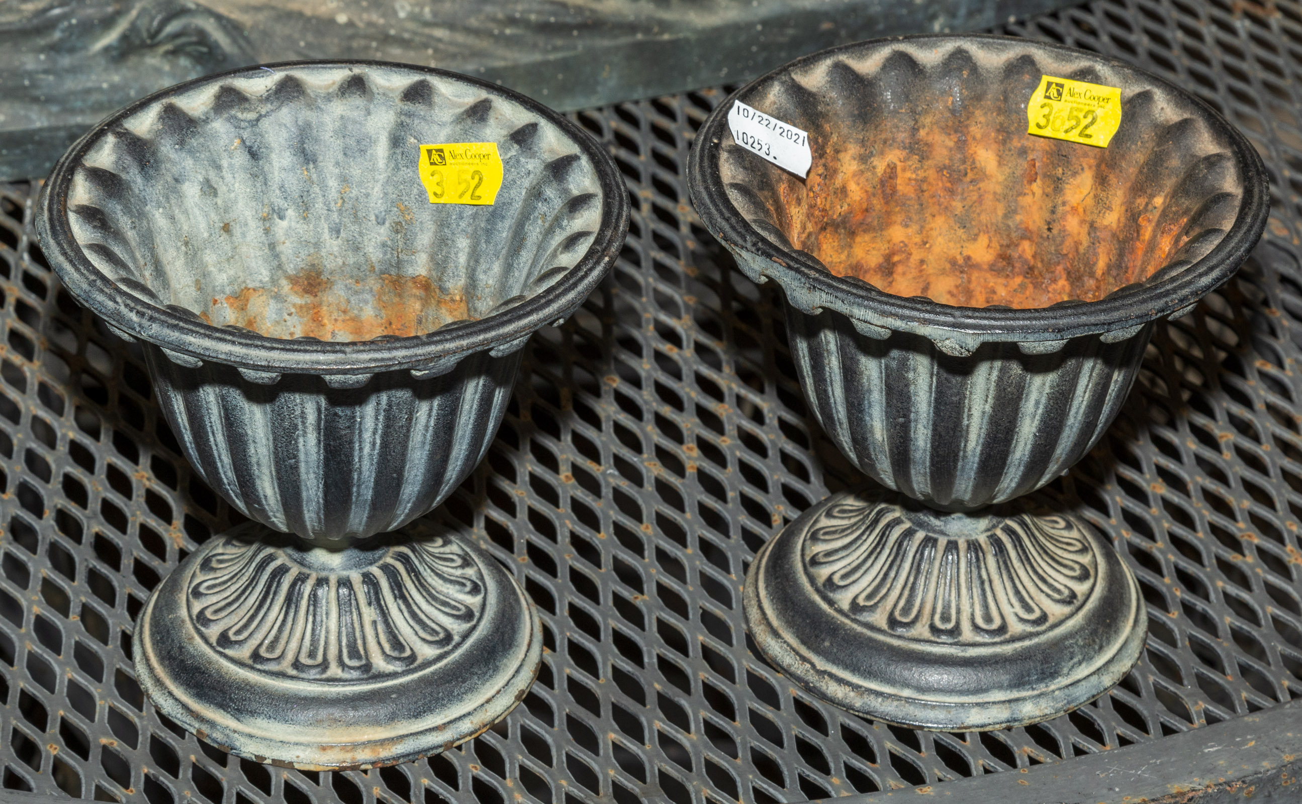 TWO SMALL CAST IRON URNS 5 1/2 in. H.