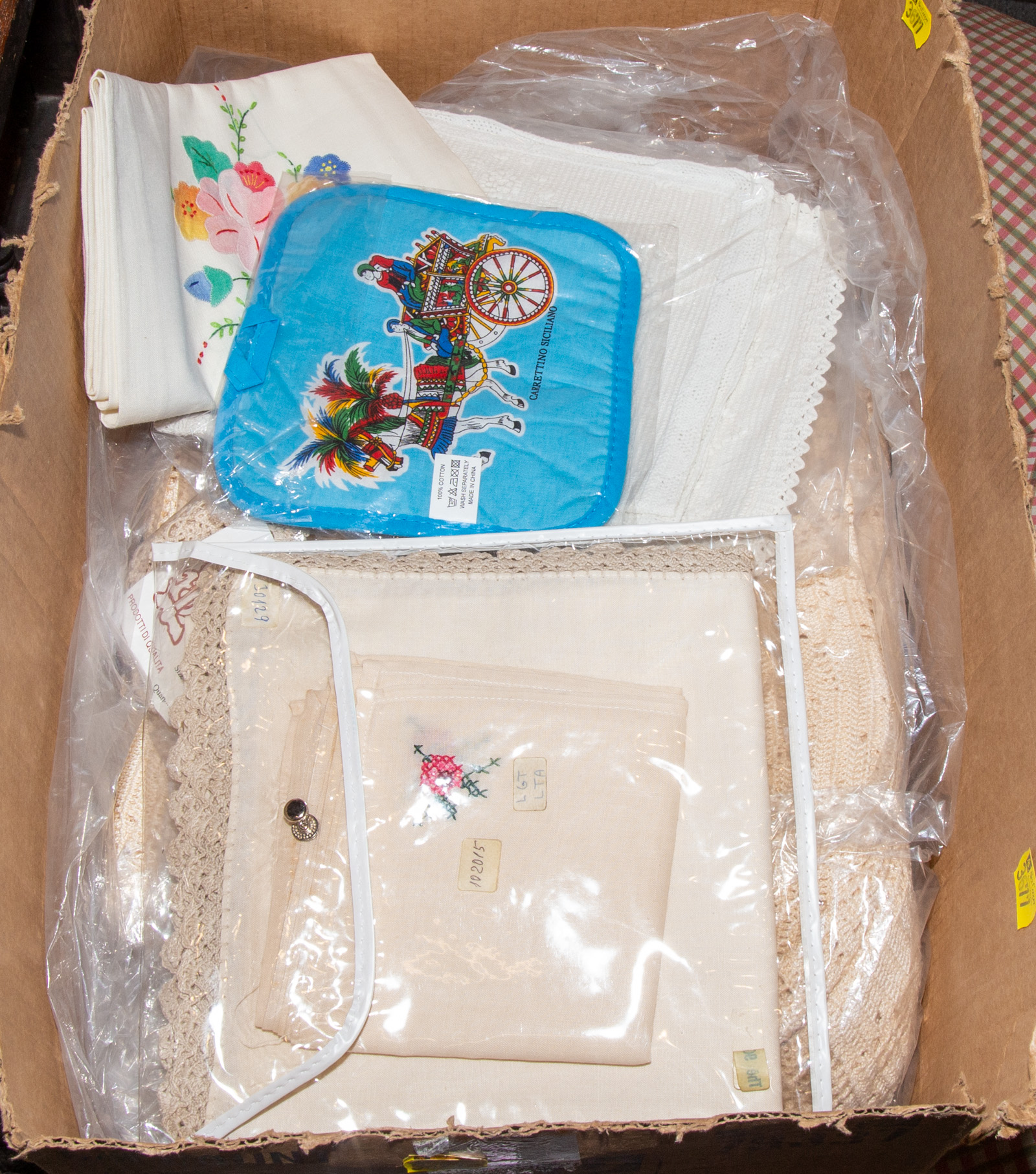 A BOX OF ASSORTED LINENS .