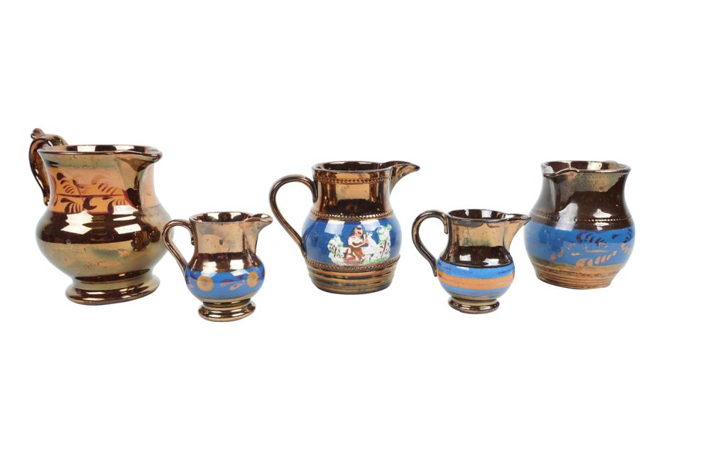 FIVE ASSORTED LUSTERWARE CREAMERScopper