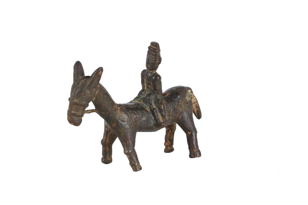 ARCHAIC BRONZE FIGURE ON DONKEYin a