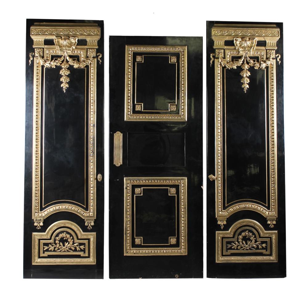 THREE EBONY & GILT DOORScomprising a