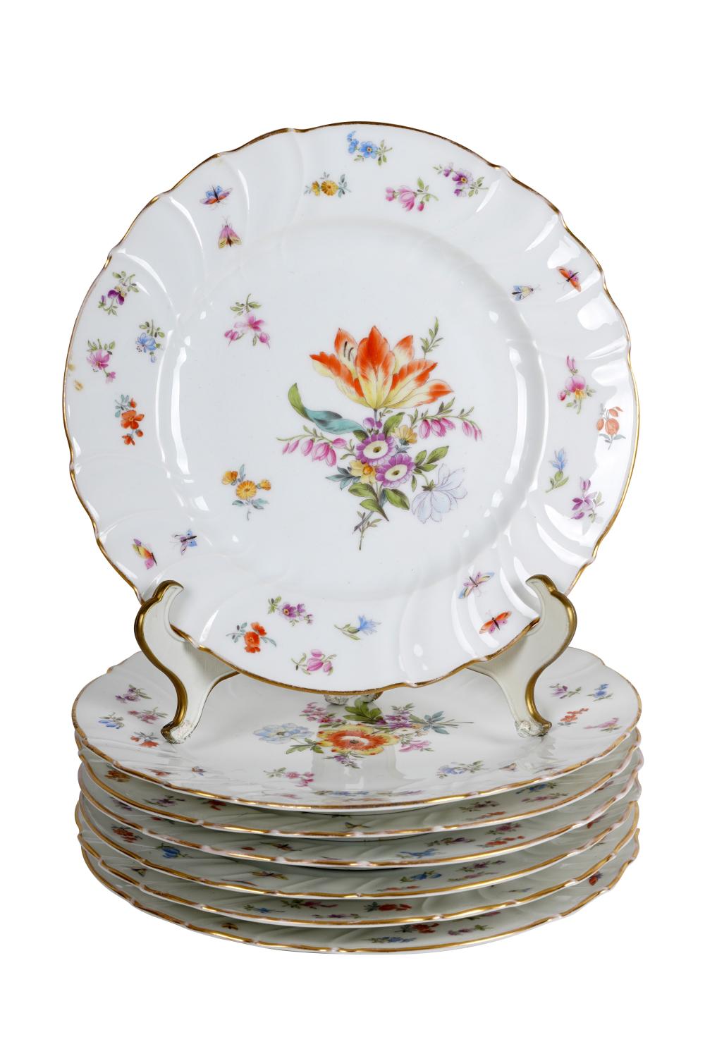 SEVEN PORCELAIN FLORAL LUNCHEON PLATESCondition: