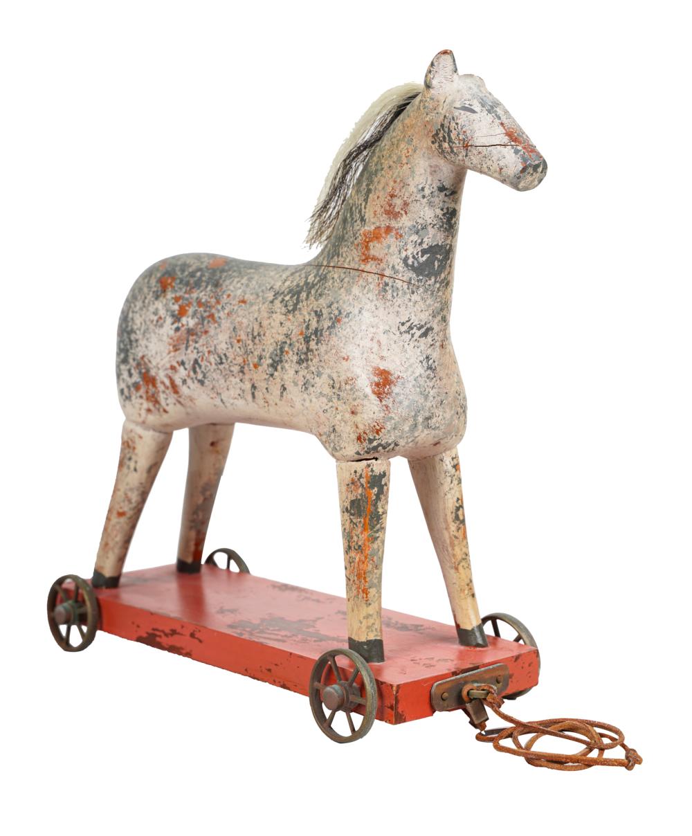 PAINTED WOOD HORSE TOYon metal wheels