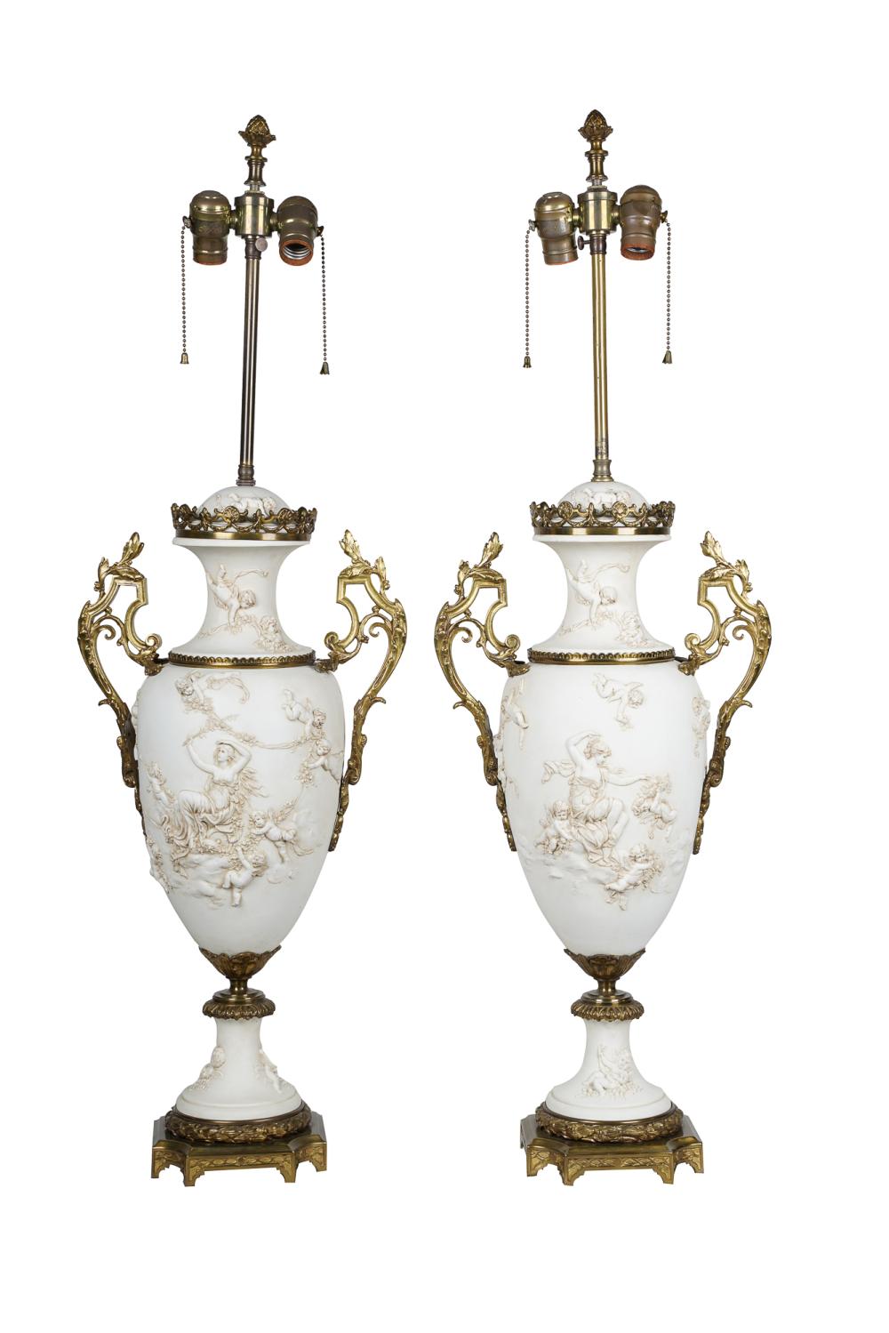 PAIR OF BISQUE PORCELAIN URNSmounted