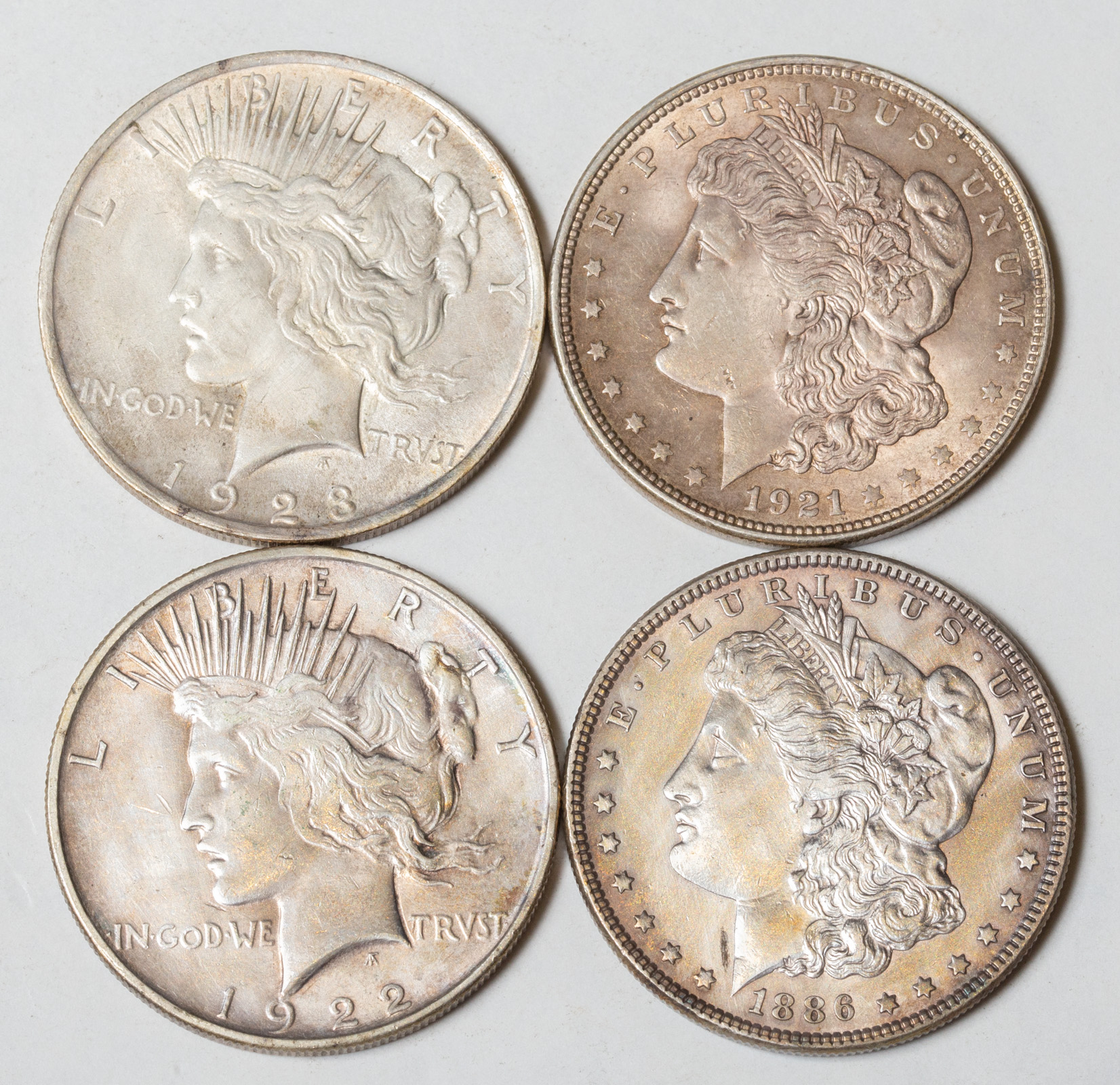 FOUR SILVER DOLLARS 1886 AU Cleaned